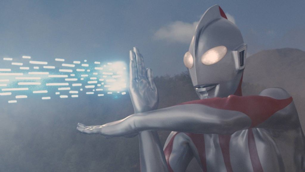 A giant robot with glowing eyes shoots white beams of light out of its upraised hand.
